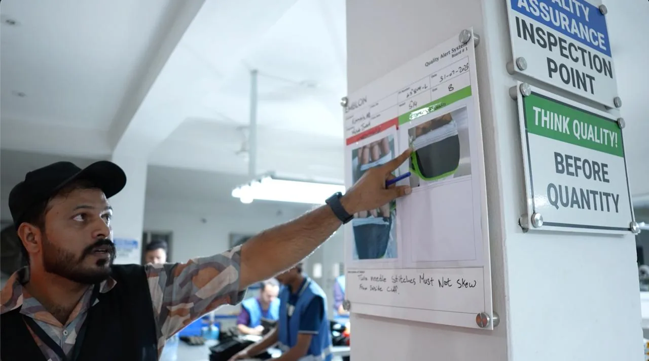 Employee reviewing a production quality alert at an inspection point