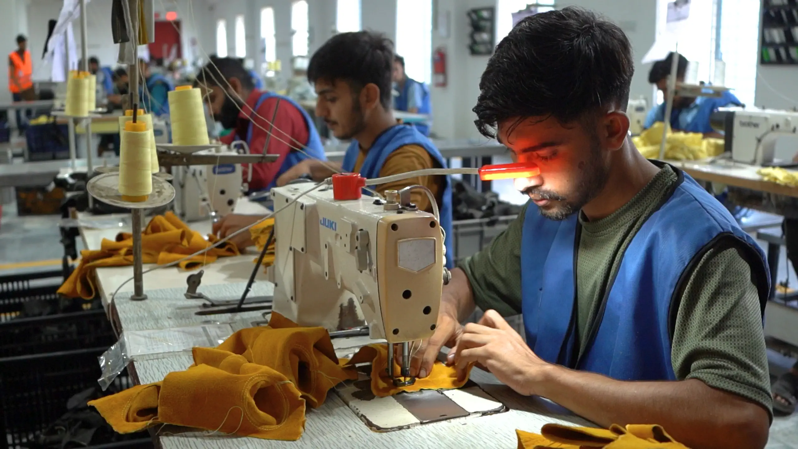 Precision sewing in glove production