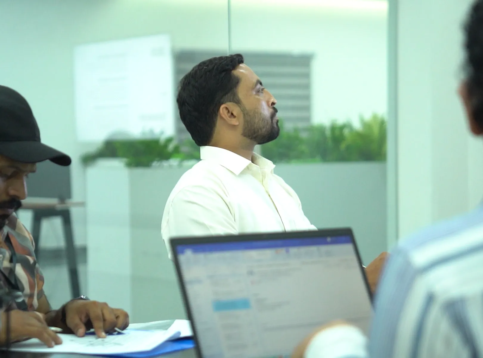 Employees participating together in a workplace meeting