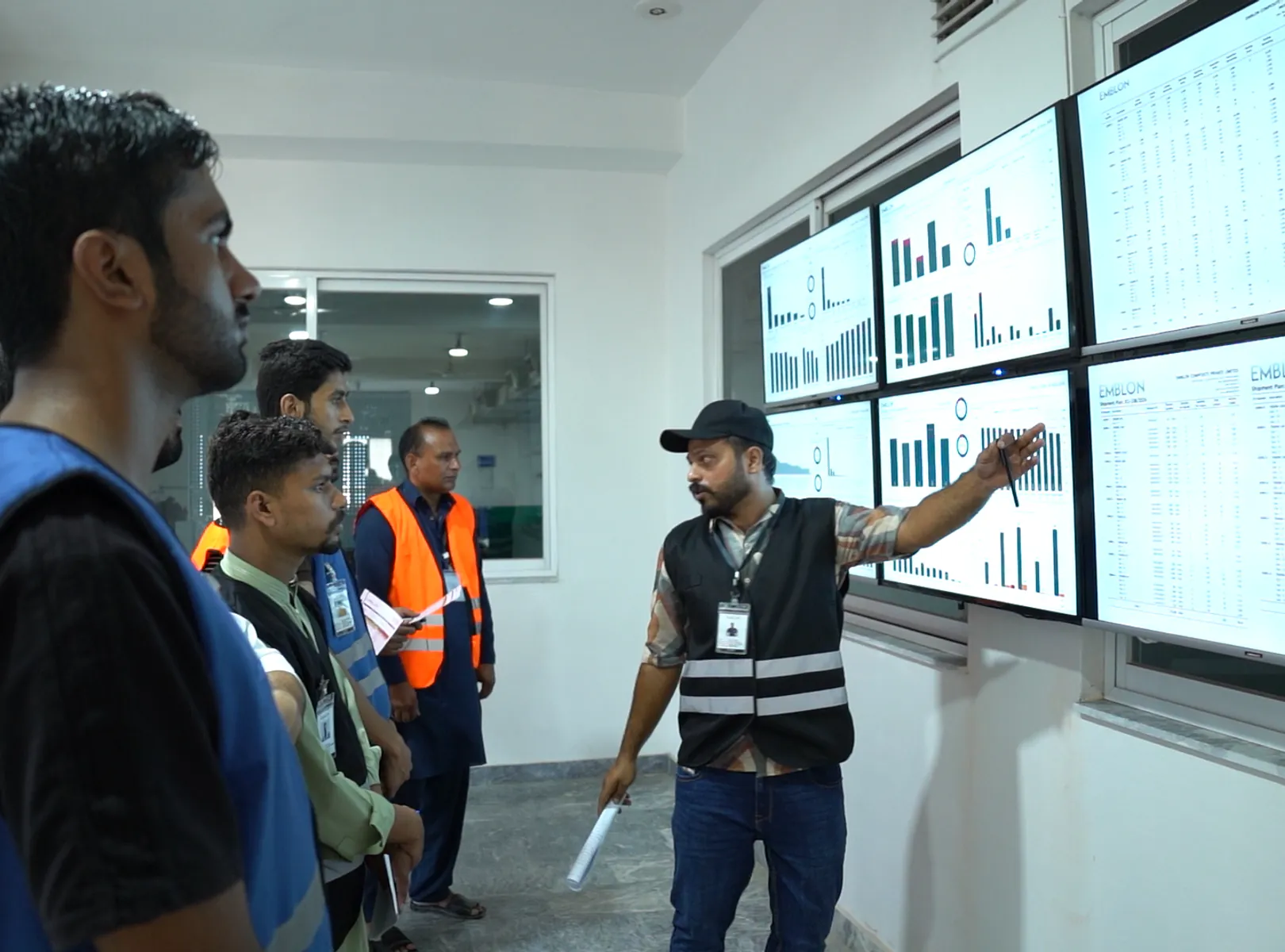 Emblon employees reviewing production information together